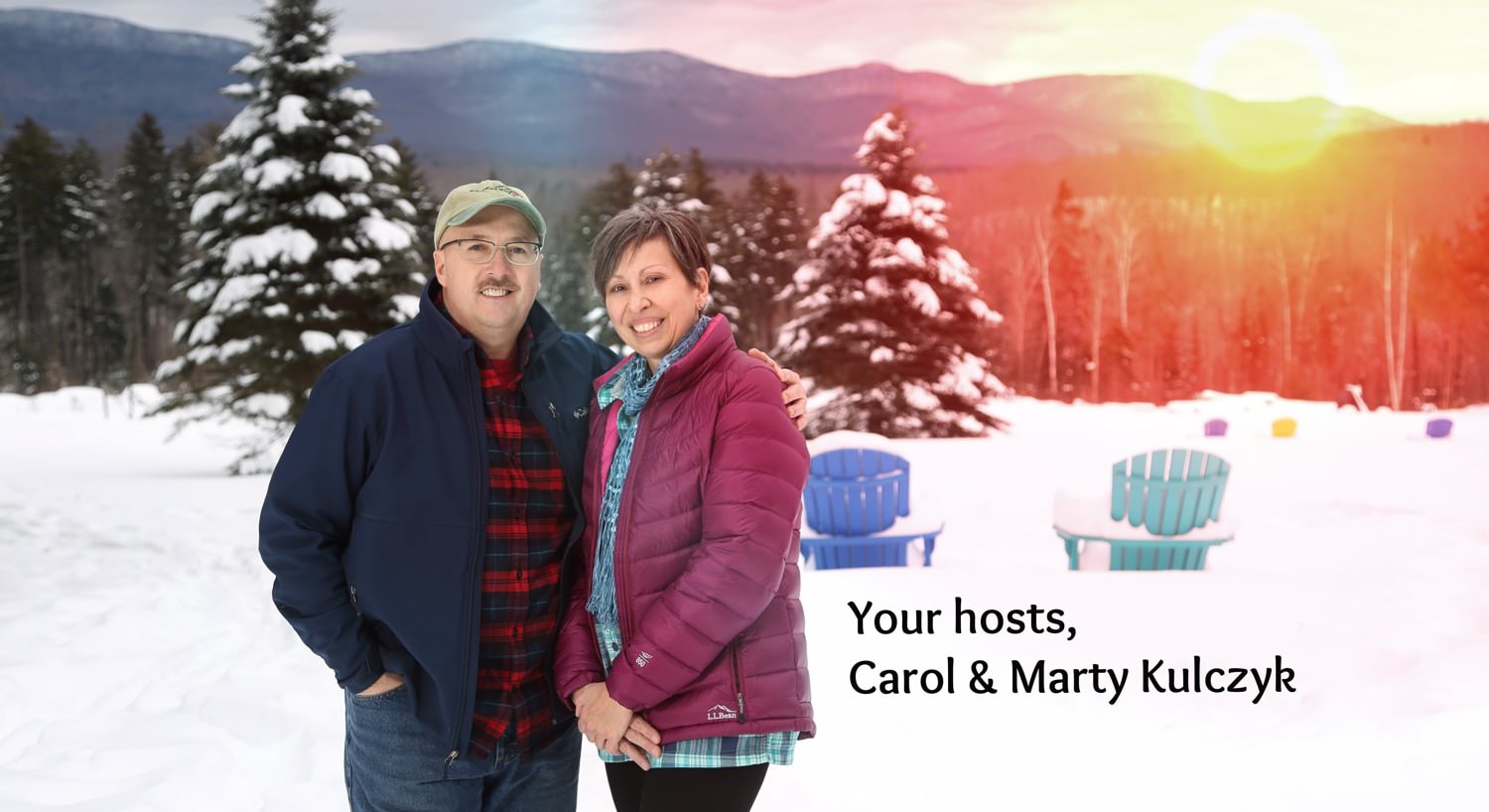 Owners Carl & Marty Kulczyk standing outside amidst snow-covered ground and trees and the sun setting behind the distant hills