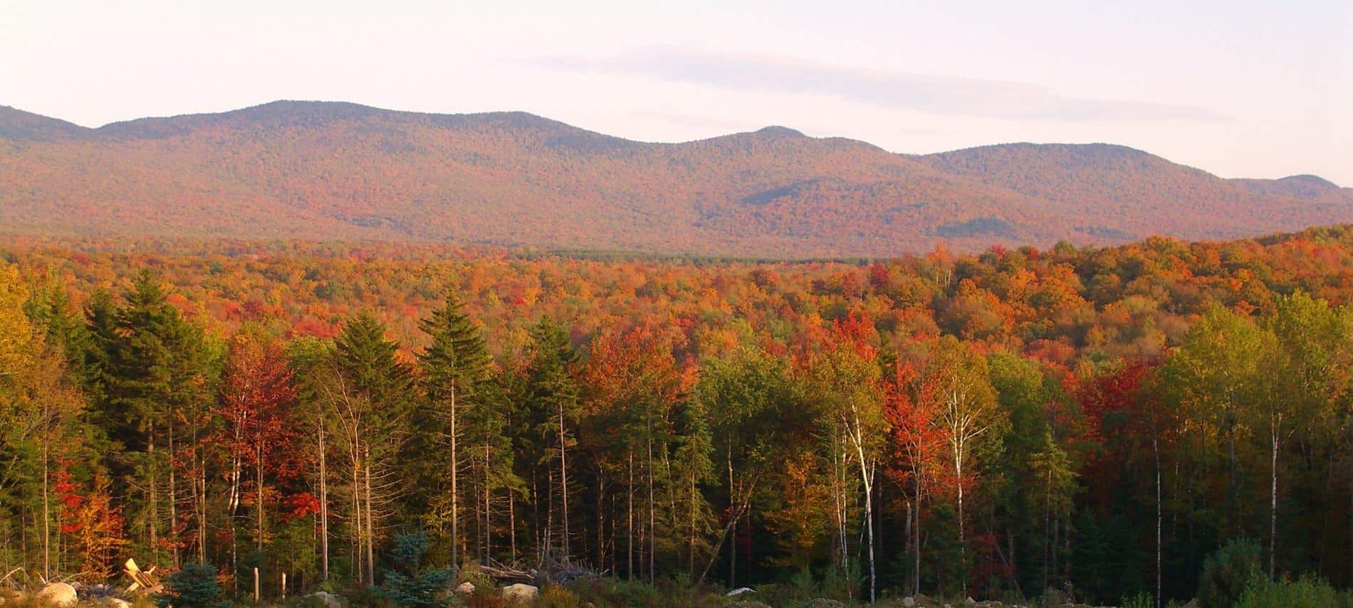 Stunning view of the surrounding tree covered hills in the fall with colorful fall foliage