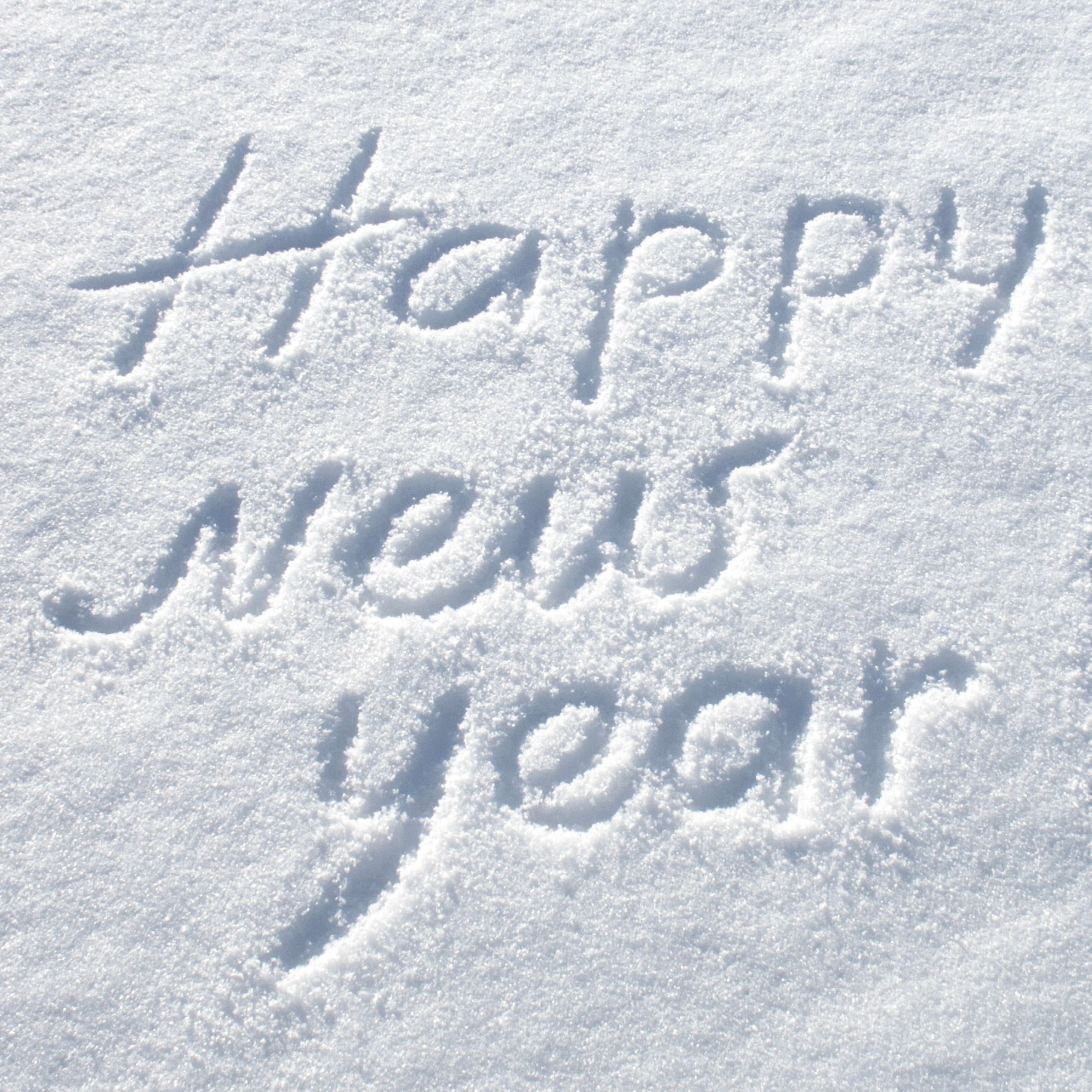 Text reading "Happy New Year" written in snow.