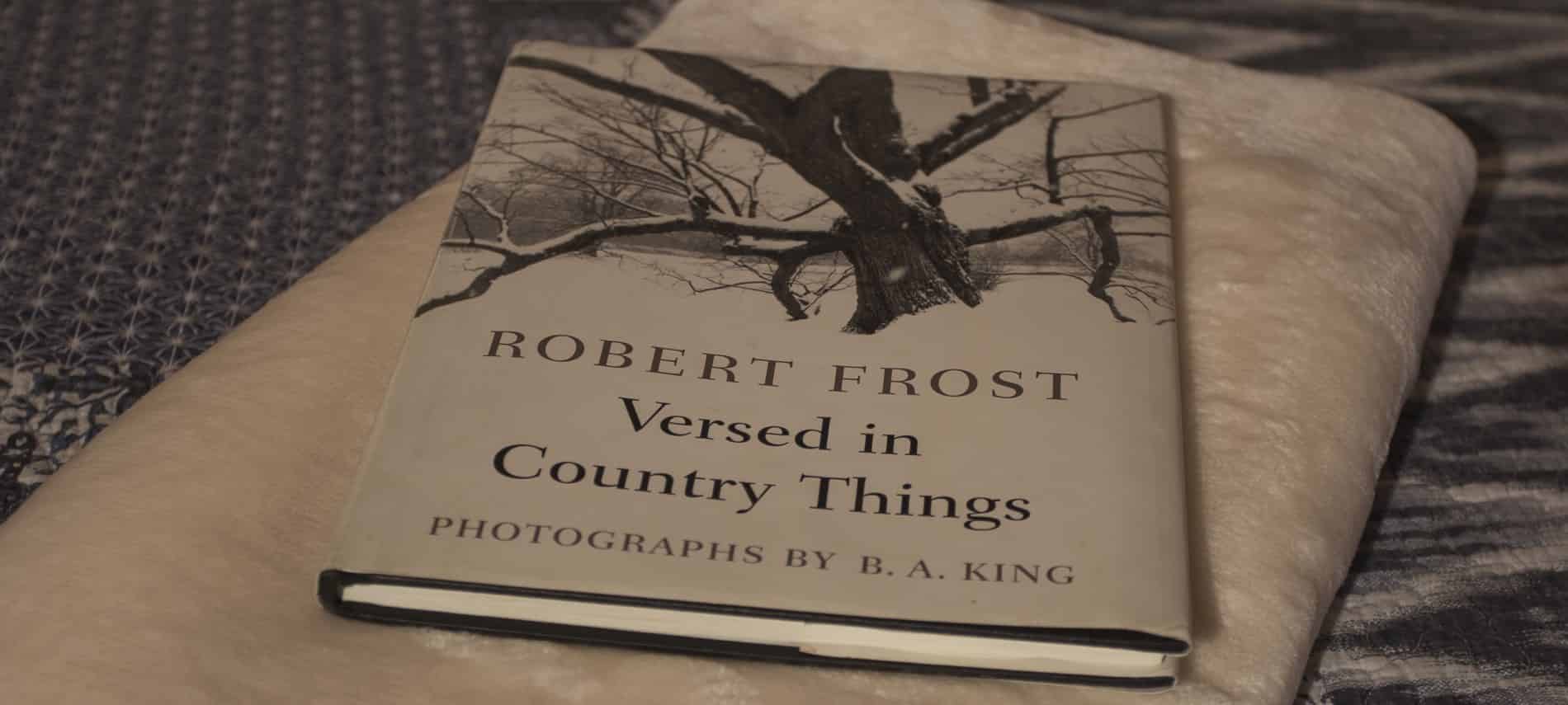 Close up view of a Robert Frost book, "Versed in Country Things"